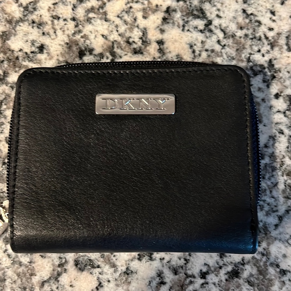 DKNY bi fold wallet, with zip closure and an outside foldout! CC, license & cash